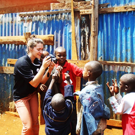 Kids in Playing With Volunteer and Camera in Ghana